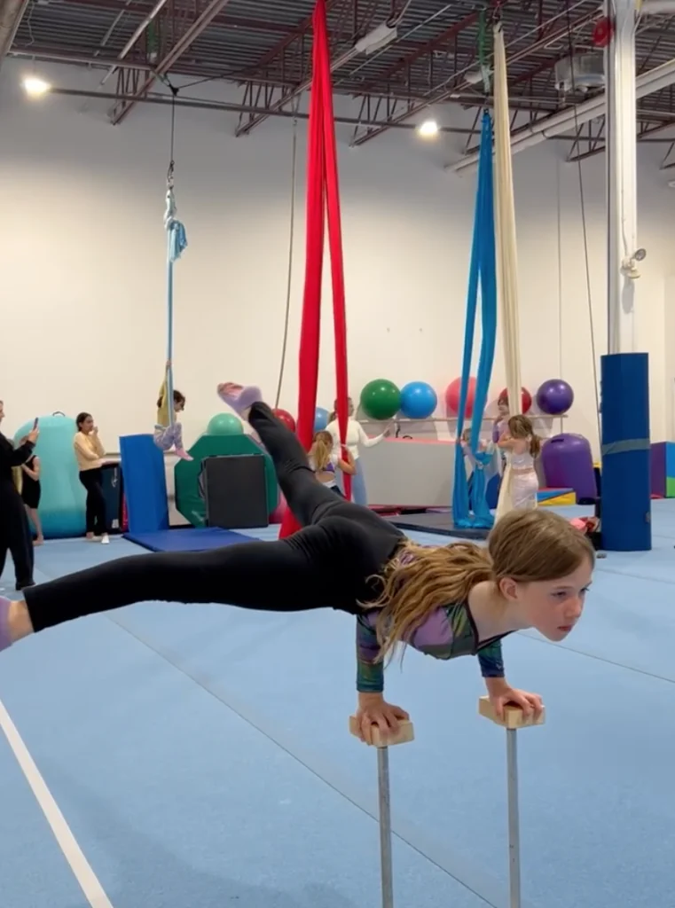 Student training contortion and handbalancing in Capital Circus Ottawa youth classes.