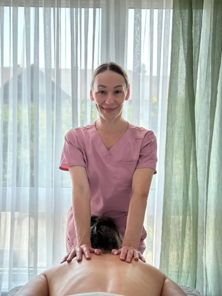 outh athlete injury prevention session showing a therapist doing massage to a young gymnast in Ottawa Gatineau area